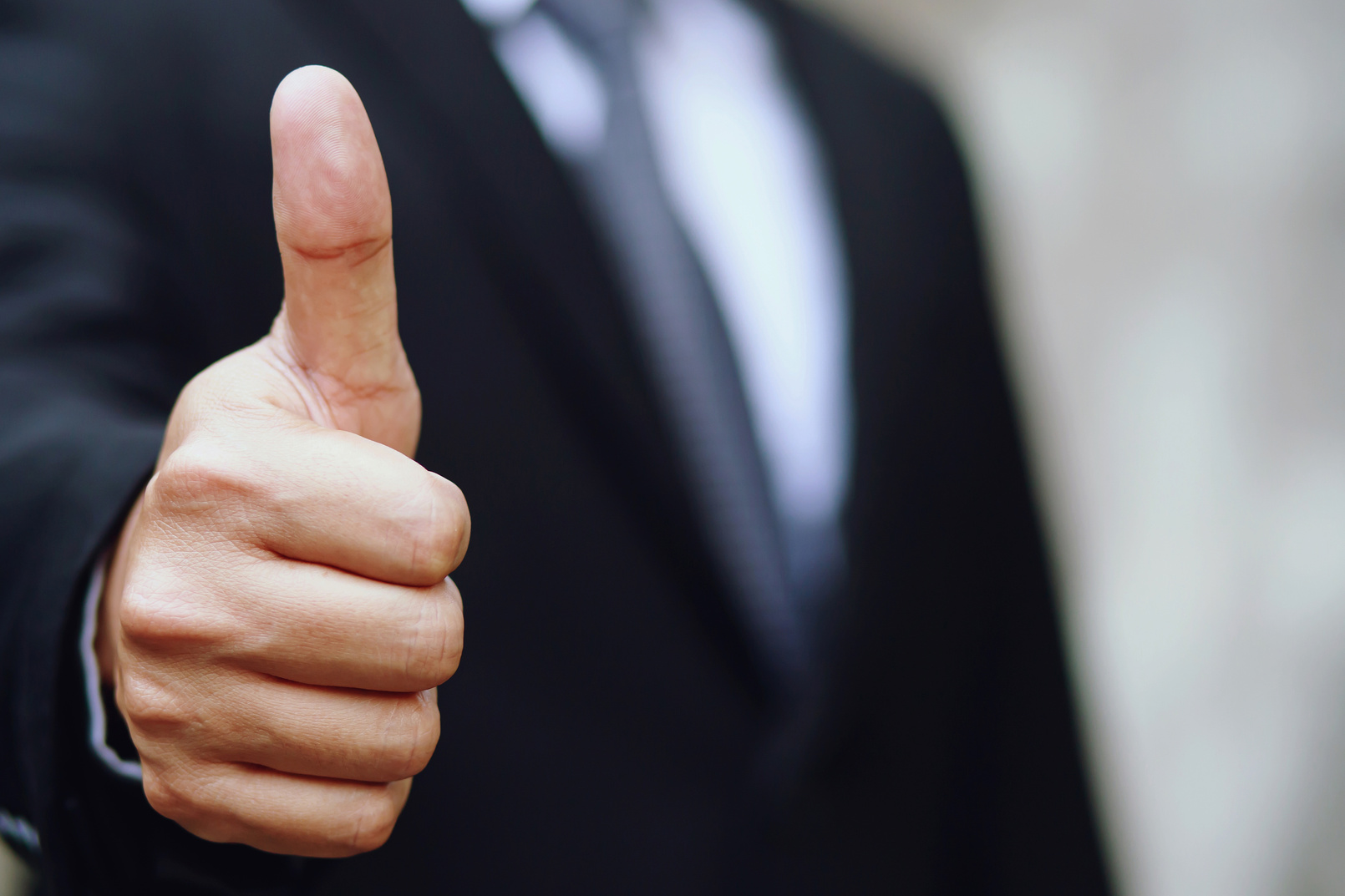 Selective Focus of a Businessman Giving a Thumbs Up